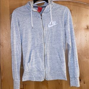 Light grey nike zip up, has a hood, size small
